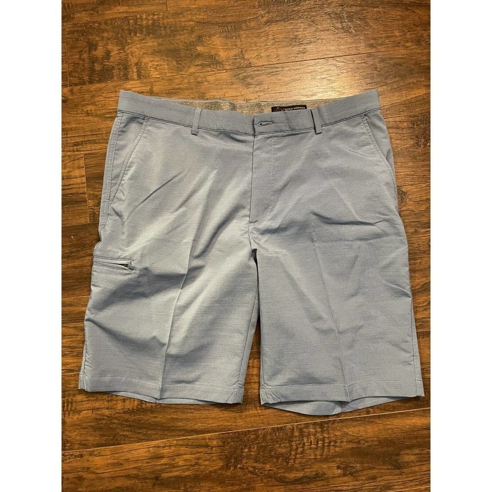 GREG NORMAN men’s GOLF SHORTS SIZE 38 BLUE GOLF SHORTS